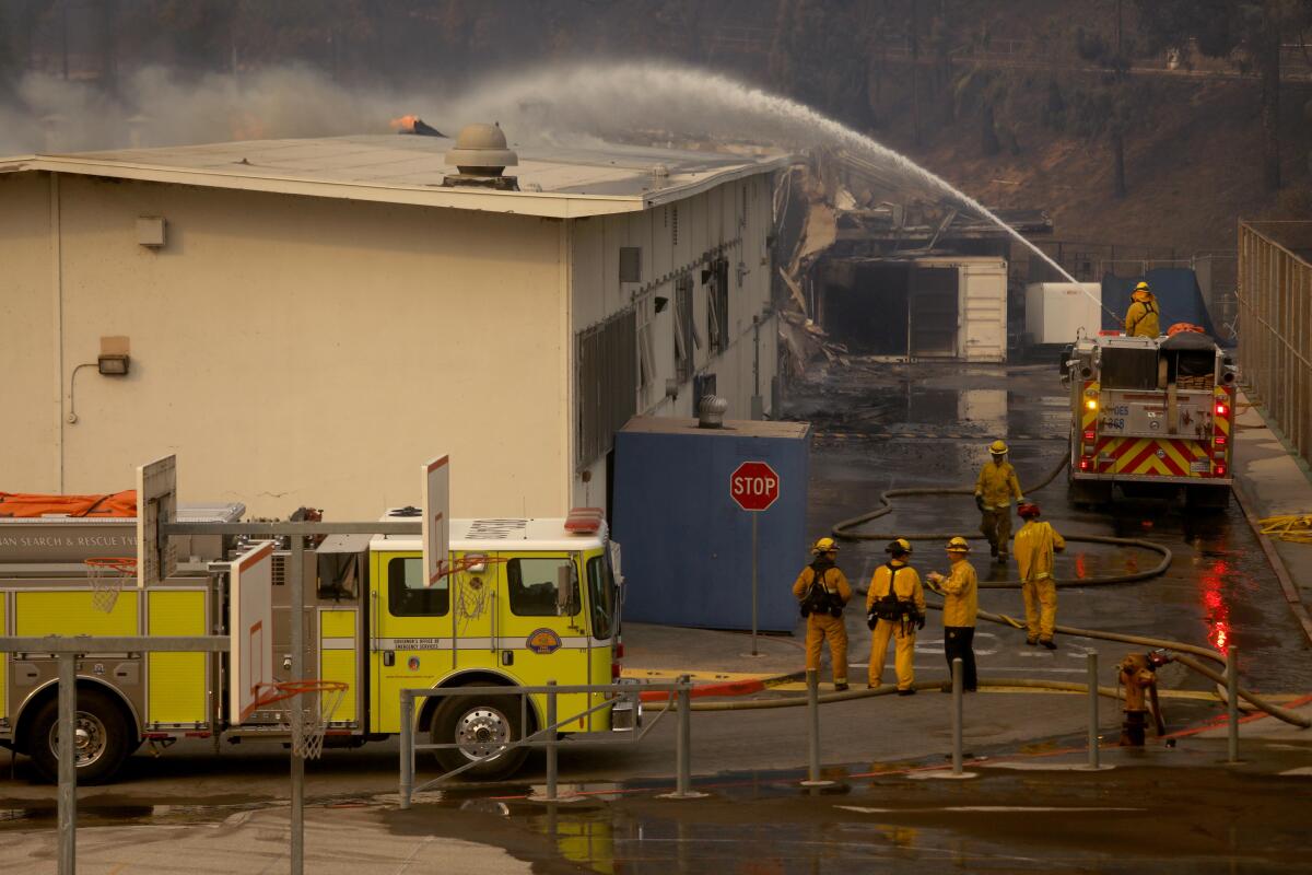 Firefighters put out a hot spot at Pali High School