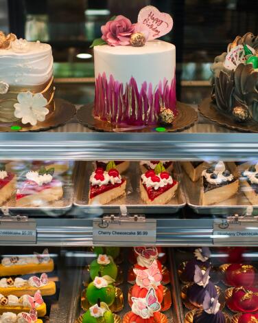 A colorful assortment of cakes and pastries on display at Art’s Bakery & Cafe in Glendale.