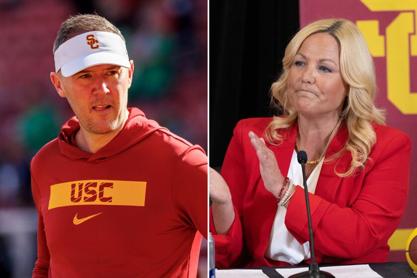 USC football coach Lincoln Riley, left, and athletic director Jennifer Cohen side by side.