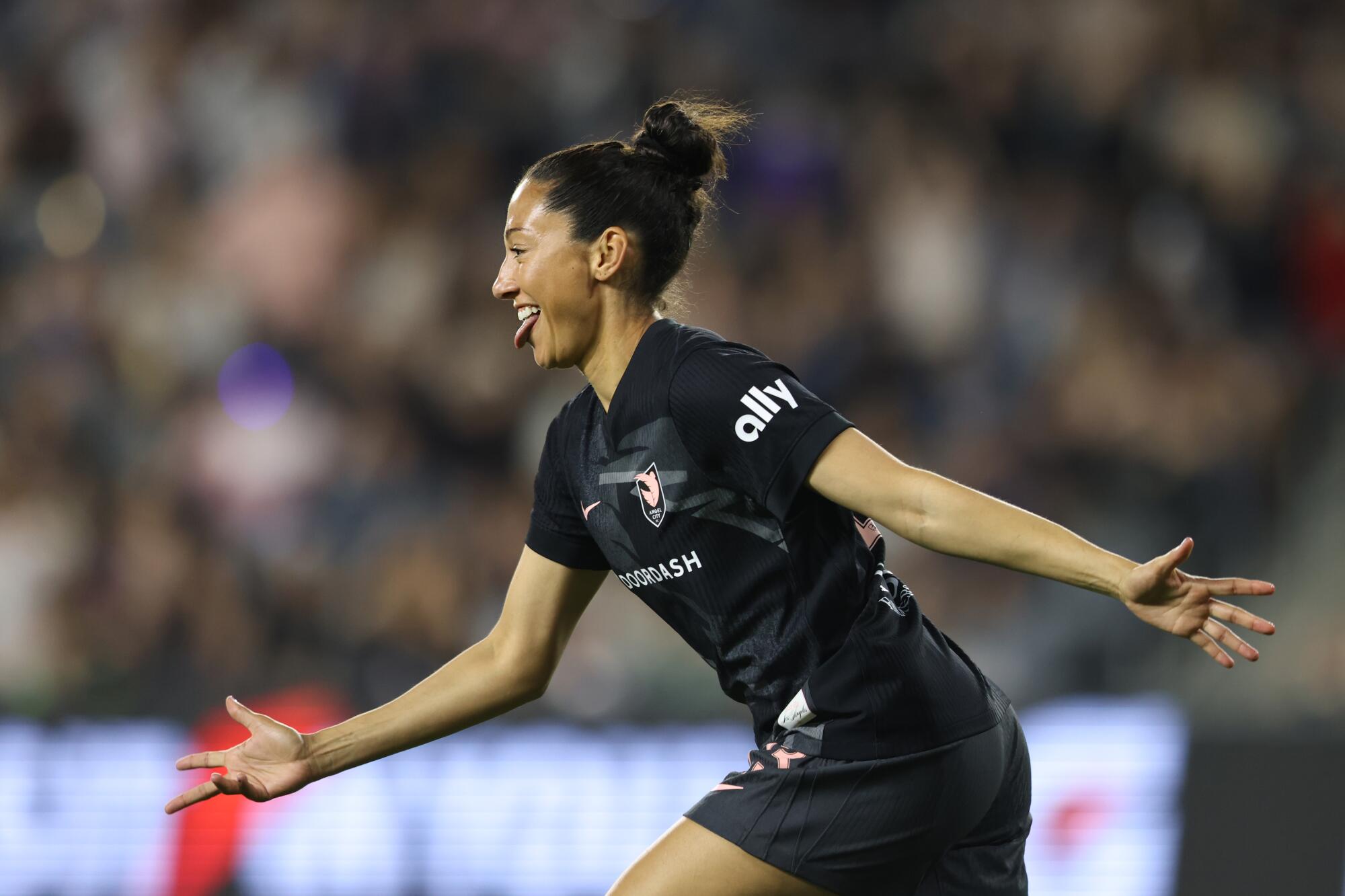 Angel City's Christen Press celebrates after scoring against Utah on May 9.