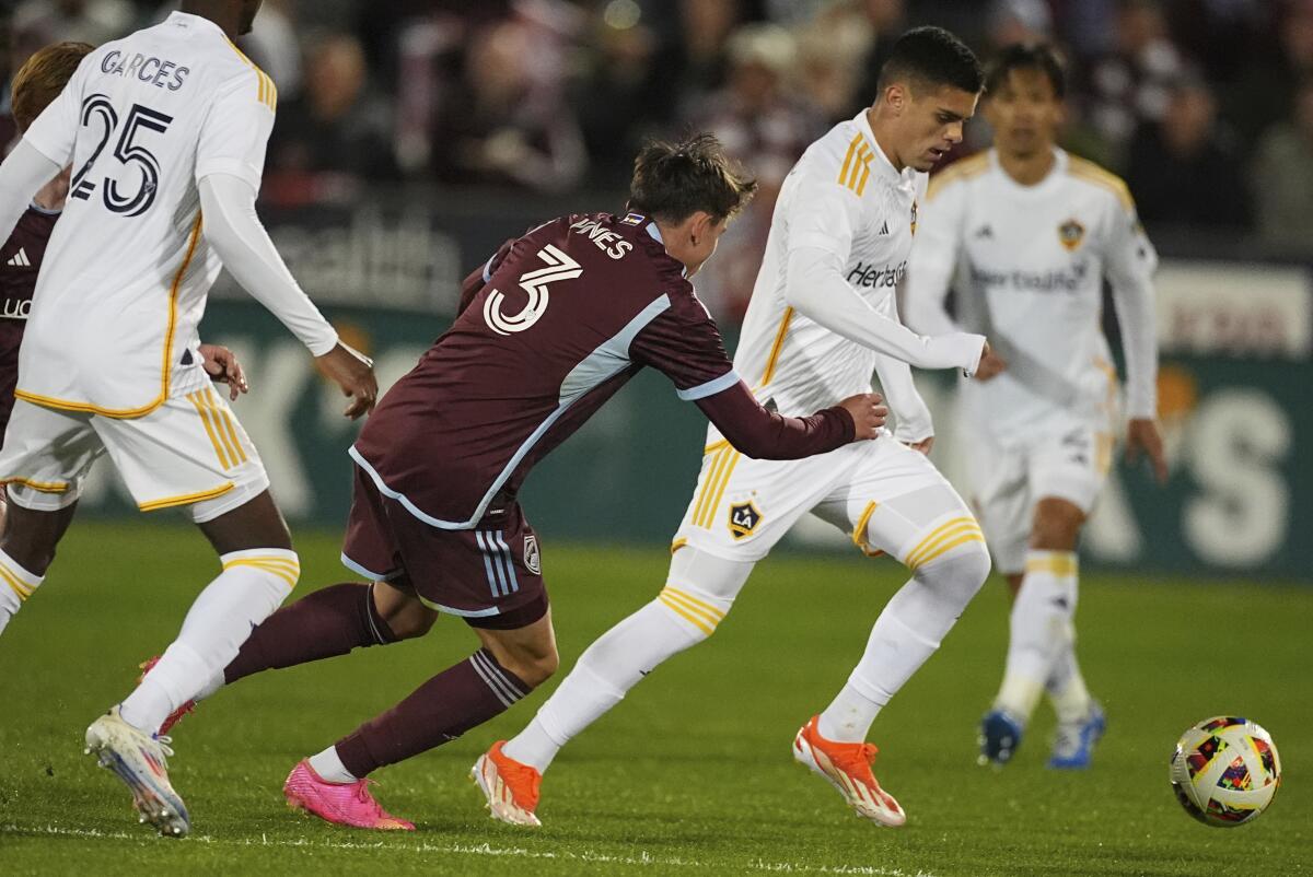 Colorado Rapids defender Sam Vines, left, pursues Galaxy forward Gabriel Pec during the Galaxy' 4-1 win.