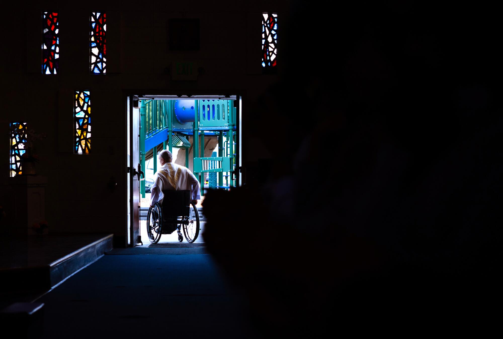 Father Cesar Galan leaves Saint Raymond Catholic Church in Downey after celebrating Mass.