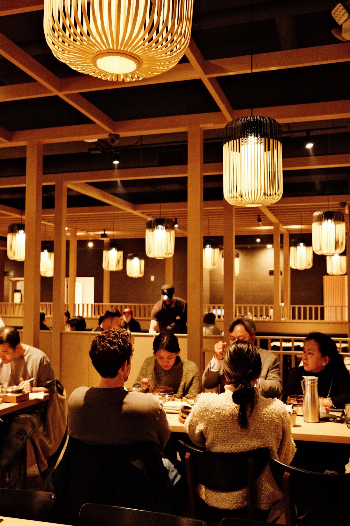 Dingers eating in the main dining room of Lasung Tofu & Pot Rice in Koreatown.