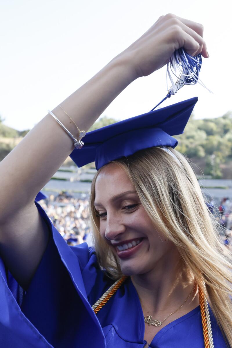 Andjela Malisich crosses her tassel.