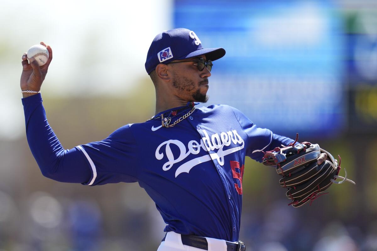 Los Angeles Dodgers shortstop Mookie Betts warms up prior to a spring training baseball game.
